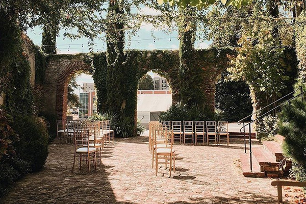 Ceremony in the courtyard. Photo by Vic Bonvicini Photography.